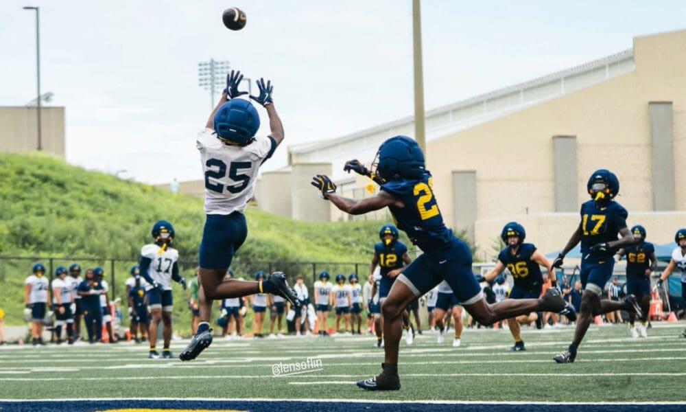 WVU Football freshman receiver Armoni Weaver leaps for a catch. WVU Athletics/Taylin Long