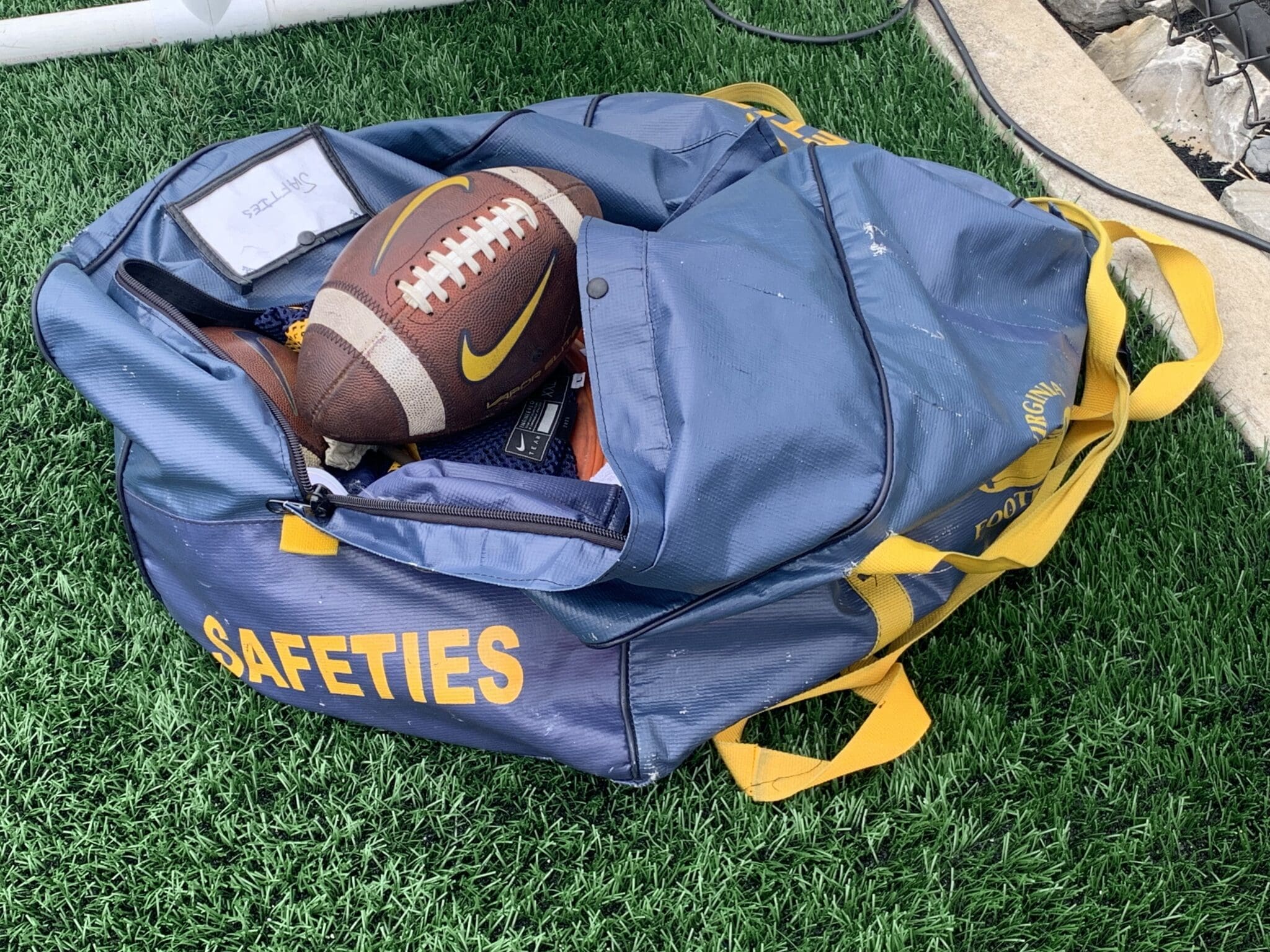 WVU Football in safeties bag stock