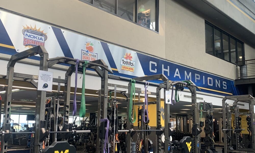 WVU Football major bowl wins on wall of weight room stock