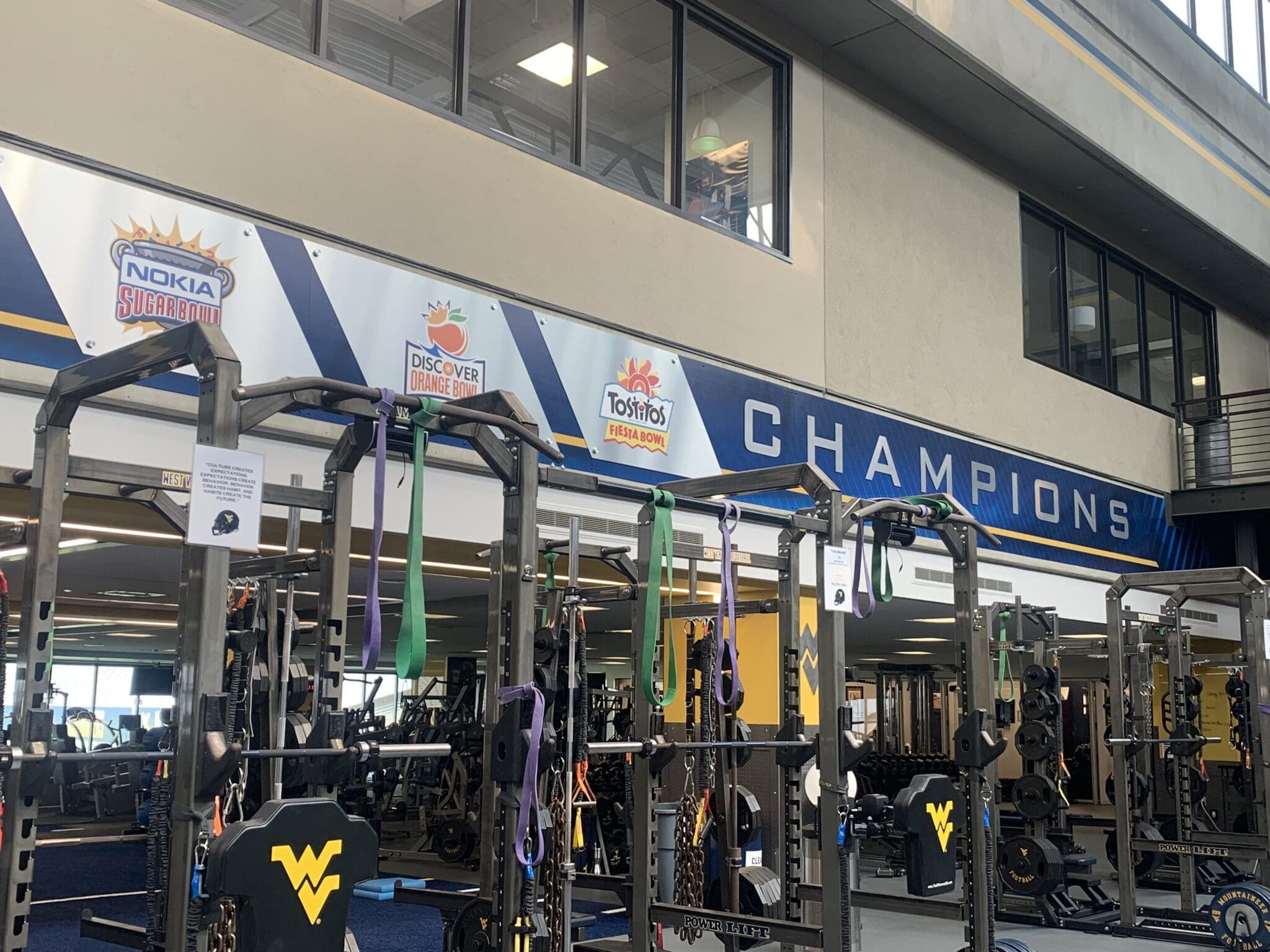 WVU Football major bowl wins on wall of weight room stock