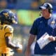 WVU Football HC Rich Rodriguez talks to Oran Singleton in season opener against RMU
