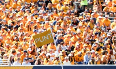 Punt flag at WVU Football game with crowd in background