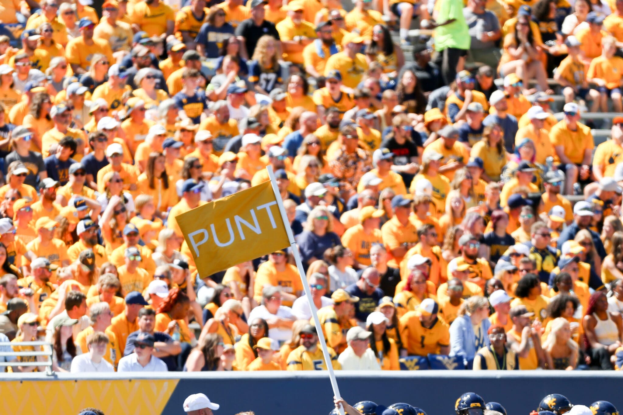 Punt flag at WVU Football game with crowd in background