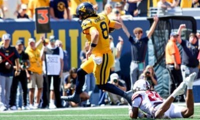 WVU Football QB Nicco Marchiol runs in for a touchdown against RMU