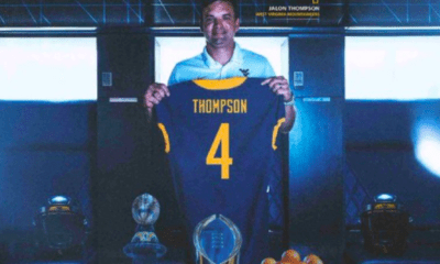 Neal Brown with WVU Football DB recruit Jalon Thompson jersey