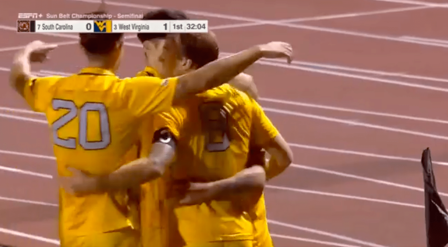 WVU men's soccer celebrates goal