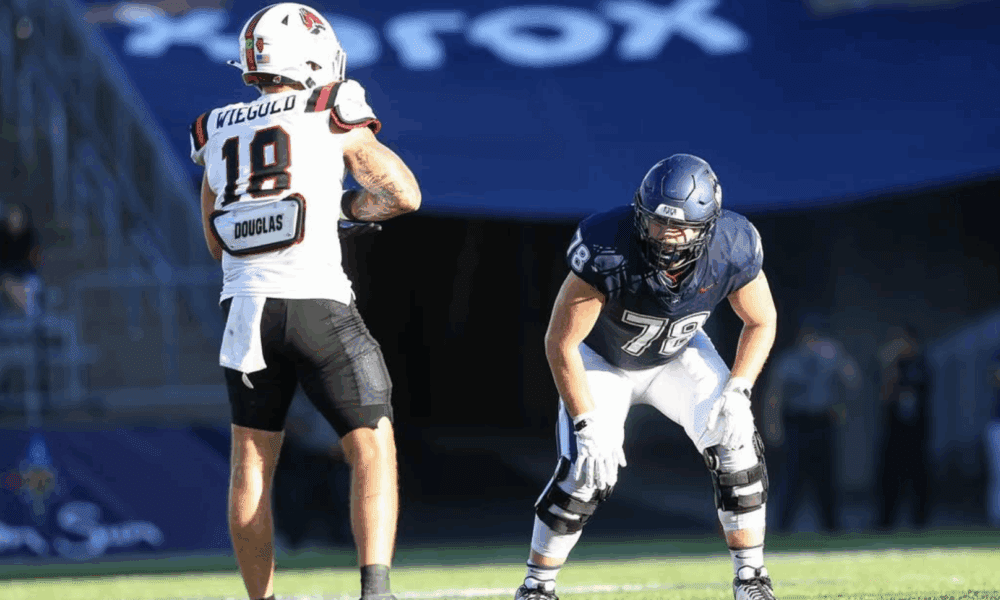 WVU Football OL Cameron Griffin with UConn