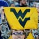 A young WVU fan holds up a towel at the Duke's Mayo Bowl on Dec. 27, 2023 at Bank of America Stadium in Charlotte, N.C. (Mitchell Northam / WV Sports Now)