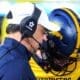 WVU quarterback Garrett Greene talks to head coach Neal Brown before taking the field against UNC in the Duke's Mayo Bowl at Bank of America Stadium in Charlotte, N.C. on Dec. 27, 2023. (Mitchell Northam / WV Sports Now)