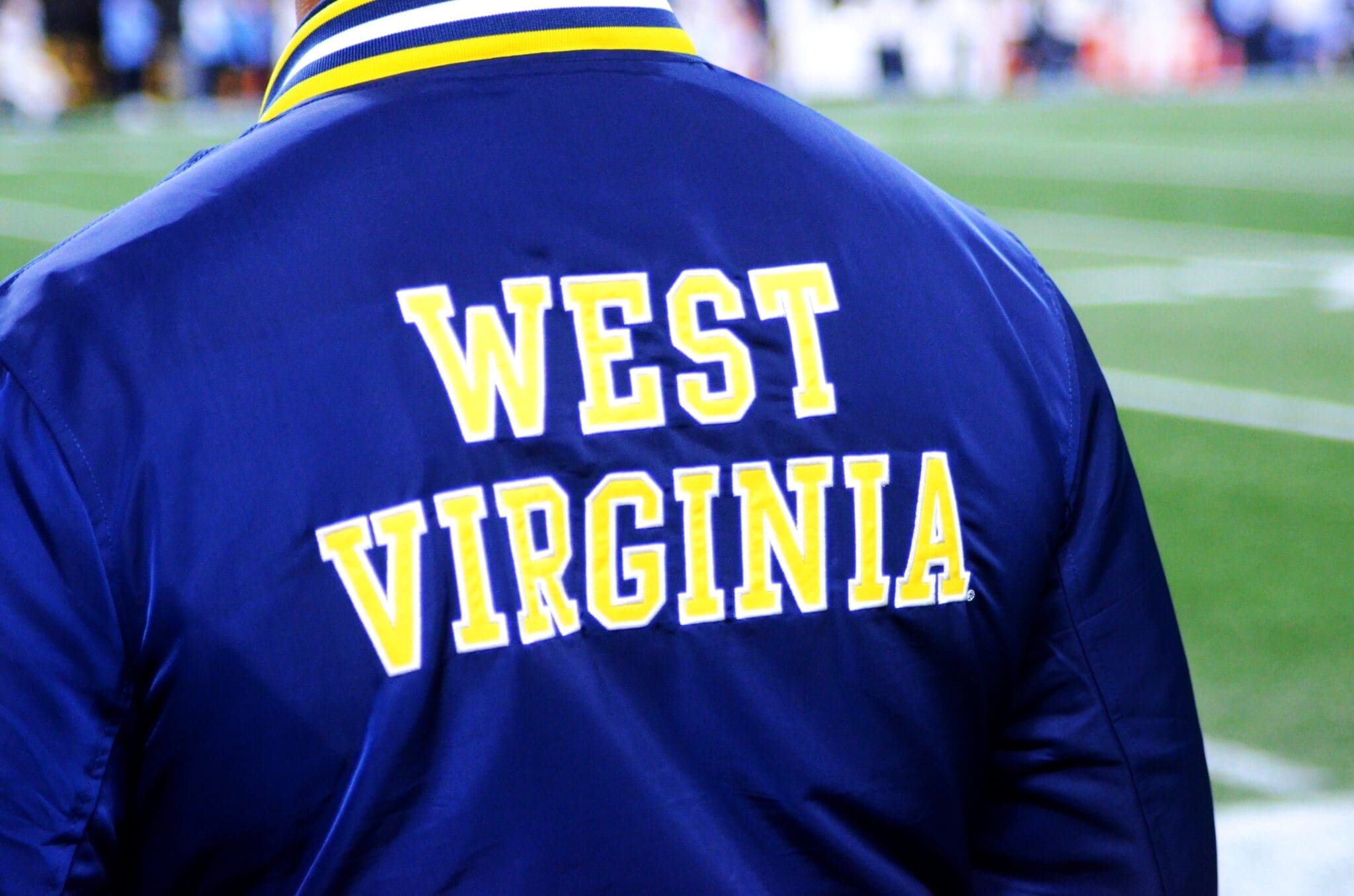 A WVU fan wears a Homefield jacket at the Duke's Mayo Bowl on Dec. 27, 2023 at Bank of America Stadium in Charlotte, N.C. (Mitchell Northam / WV Sports Now)
