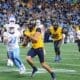 WVU Football tight end Kole Taylor breaks away for a big gain against UNC in the Duke's Mayo Bowl at Bank of America Stadium in Charlotte, N.C. on Dec. 27, 2023. (Mitchell Northam / WV Sports Now)