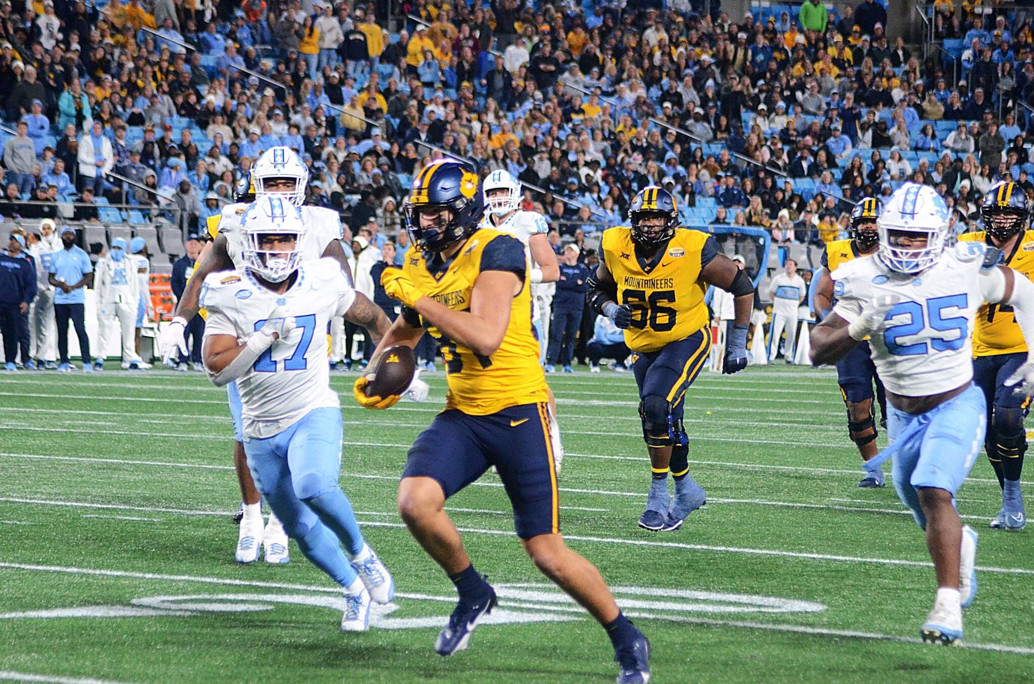 WVU Football tight end Kole Taylor breaks away for a big gain against UNC in the Duke's Mayo Bowl at Bank of America Stadium in Charlotte, N.C. on Dec. 27, 2023. (Mitchell Northam / WV Sports Now)