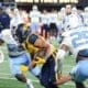 WVU running back Jahiem White rushes against UNC in the Duke's Mayo Bowl at Bank of America Stadium in Charlotte, N.C. on Dec. 27, 2023. (Mitchell Northam / WV Sports Now)