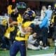 WVU running back Jahiem White celebrates his touchdown against UNC in the Duke's Mayo Bowl at Bank of America Stadium in Charlotte, N.C. on Dec. 27, 2023. (Mitchell Northam / WV Sports Now)