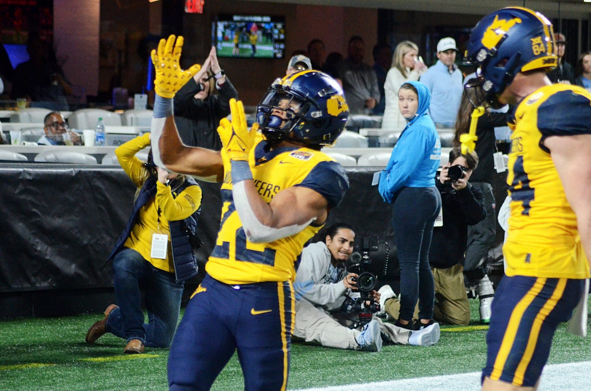 WVU running back Jahiem White celebrates his touchdown against UNC in the Duke's Mayo Bowl at Bank of America Stadium in Charlotte, N.C. on Dec. 27, 2023. (Mitchell Northam / WV Sports Now)