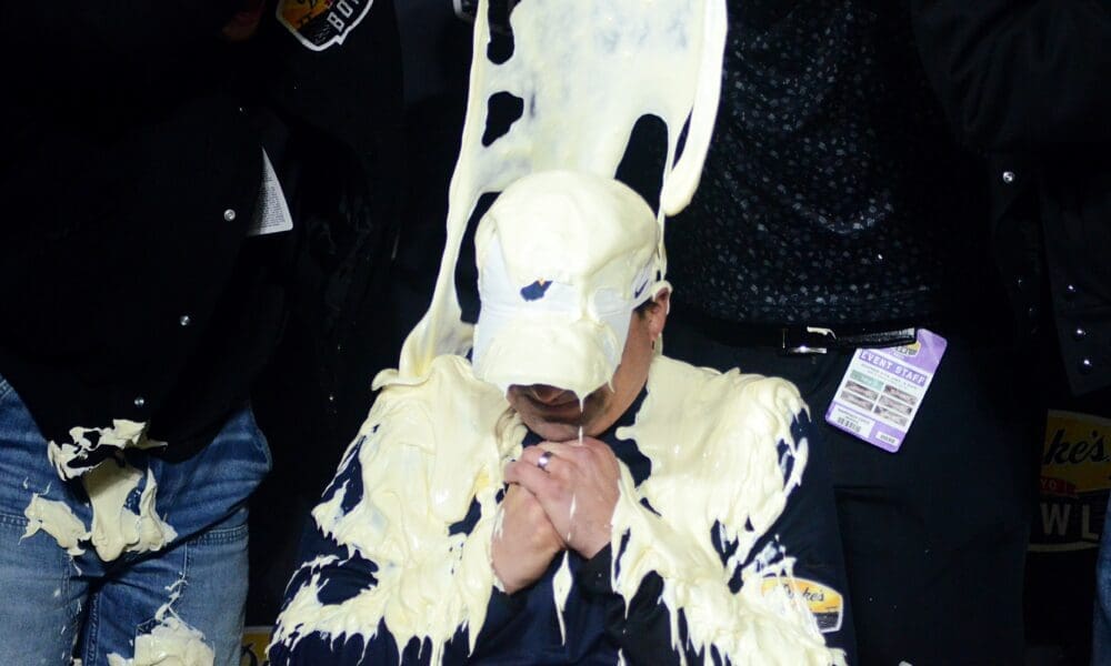 WVU head coach Neal Brown gets a mayo bath after beating UNC in the Duke's Mayo Bowl at Bank of America Stadium in Charlotte, N.C. on Dec. 27, 2023. (Mitchell Northam / WV Sports Now)