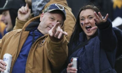 WVU fans holding beer at UCF win