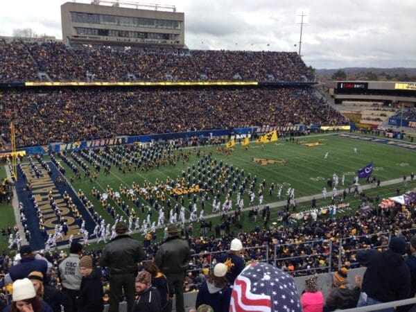 WVU Football Stadium and Field US Flags Stock