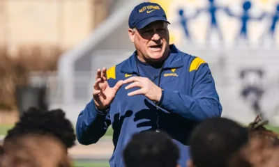 WVU Football HC Rich Rodriguez talking to team after practice