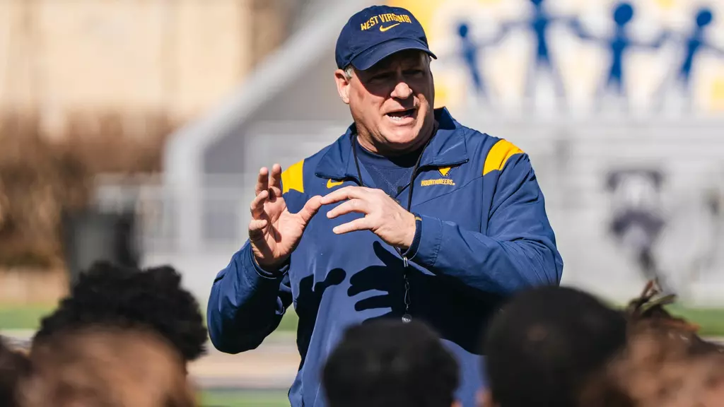 WVU Football HC Rich Rodriguez talking to team after practice