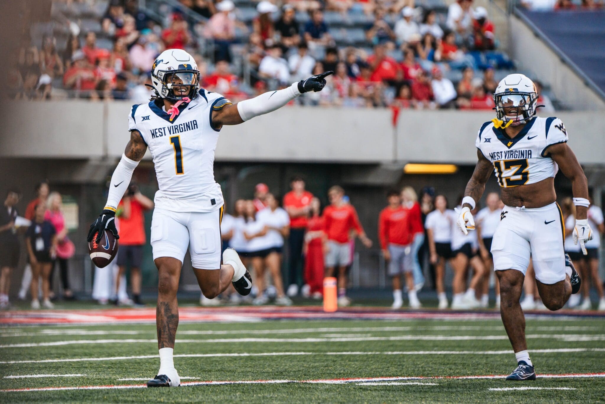 WVU Football defense with Garnett Hollis at Arizona