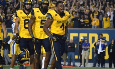 WVU Football Nicco Marchiol, CJ Donaldson, Devin Carter CJ helmet off