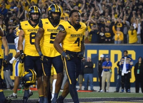 WVU Football Nicco Marchiol, CJ Donaldson, Devin Carter CJ helmet off