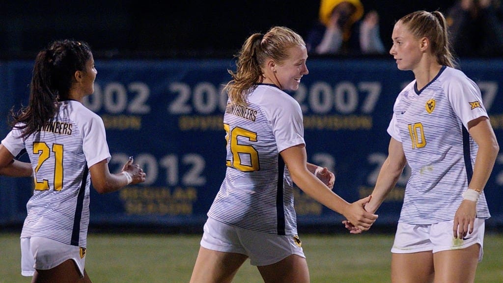 WVU women's soccer team celebrates win